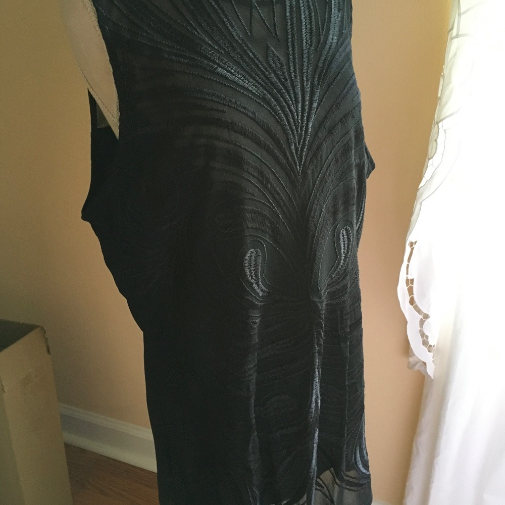Rayon stretch black blouse. Embellished with embroidery design. Sleeveless.